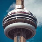 A close-up photograph of the CN Tower on a bright sunny day, Toronto, Ontario, Canada.