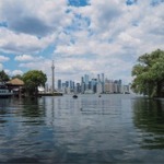 The Toronto skyline taken from Toronto Island in Lake Ontario. The CN Tower is in the middle of the photo.