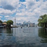 The Toronto skyline taken from Toronto Island in Lake Ontario. The CN Tower is in the middle of the photo.