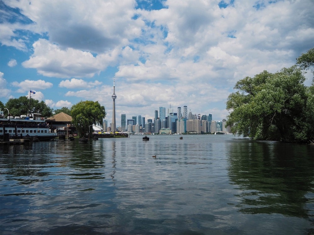 The Toronto skyline viewed from Toronto Island in Lake Ontario. The CN Tower is in the middle of the photo.