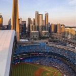 A baseball game at the Rogers Centre in Toronto with the CN Tower in the background.