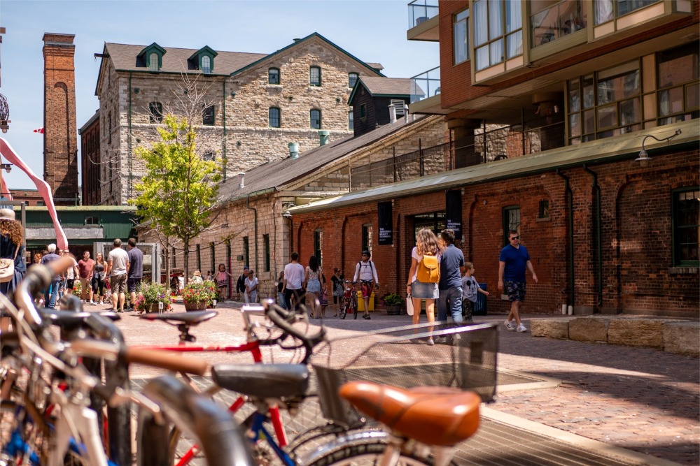 This is a photograph of people walking in the Distillery District of Toronto, Ontario, Canada.