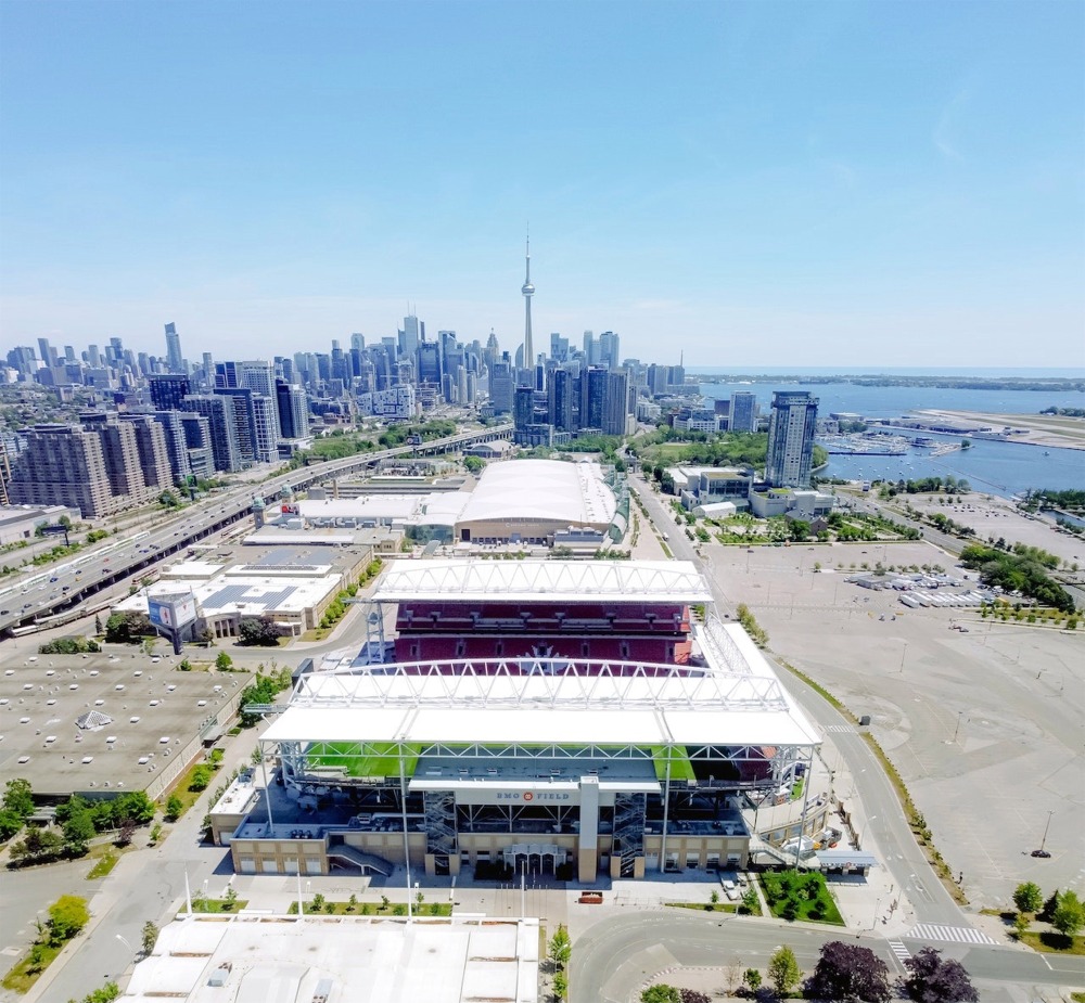 Photograph of the BMO Field, Exhibition Place, the Gardiner Expressway and the central business district of Toronto, Ontario, Canada.