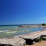 People walking at the beach of Lake Ontario in the Rouge National Urban Park.