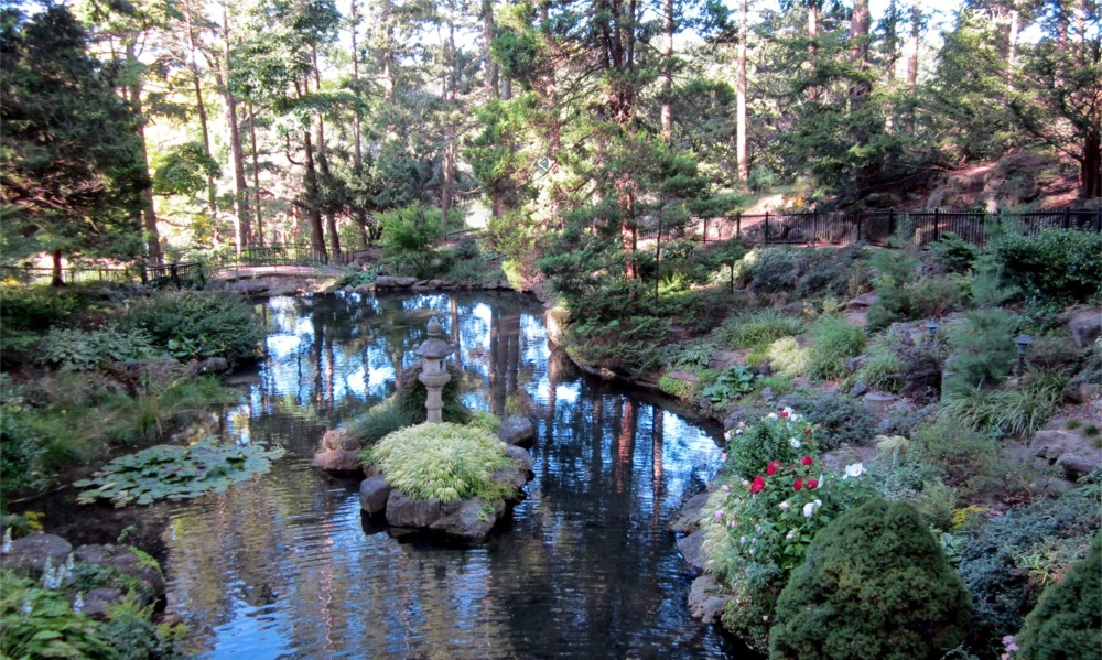 Photograph of a pond, bridge and walkway in High Park in Toronto, Ontario, Canada.