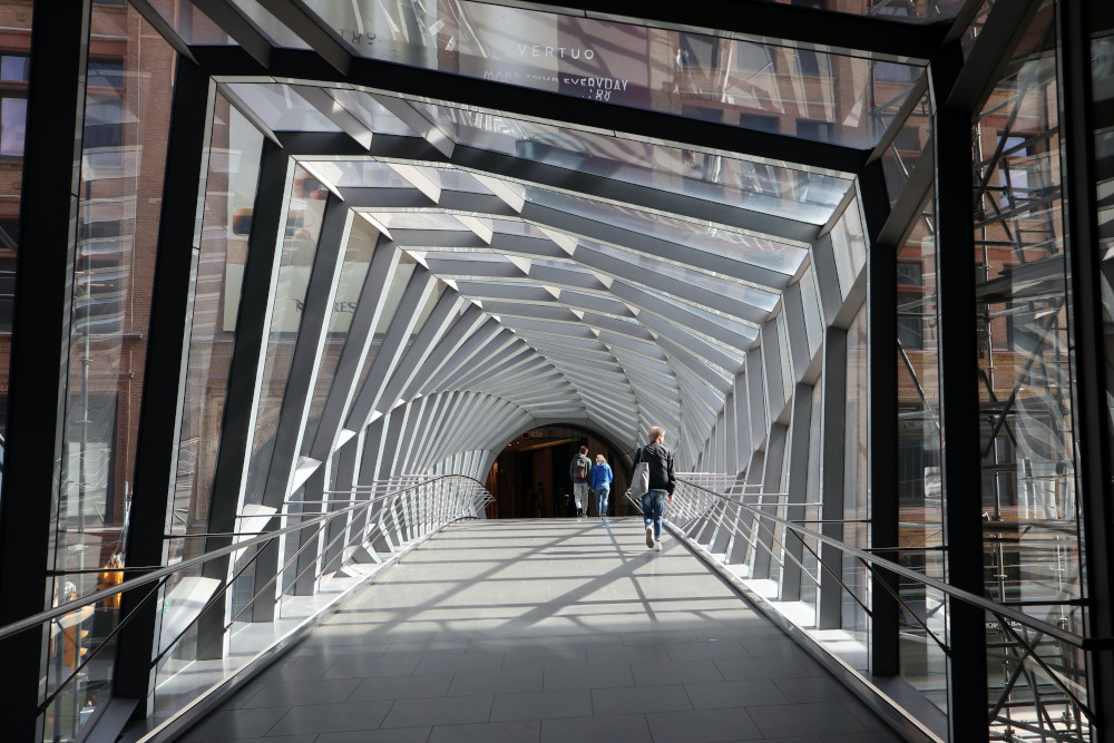 The Eaton Centre Bridge in Toronto is artistically pleasing with the beams that appear to spiral in a non uniform manner.