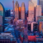 Downtown Toronto, Ontario, Canada cityscape featuring the CN Tower and the Gooderham Building aka Flatiron Building.