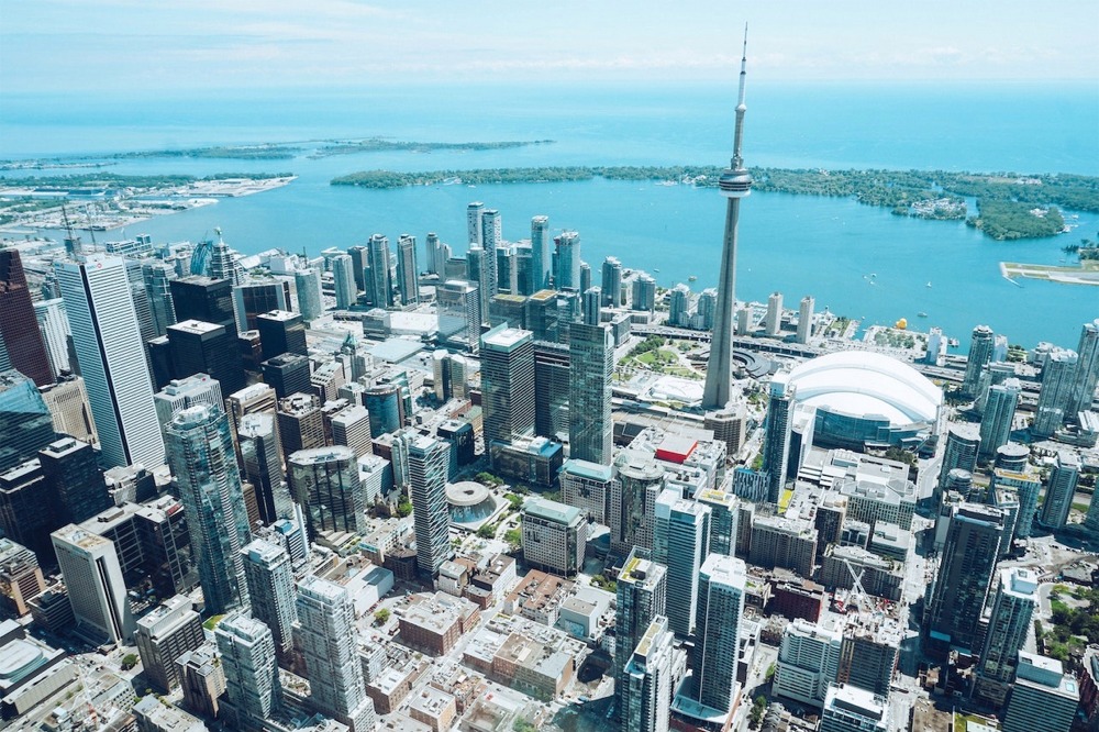 Downtown Toronto cityscape, CN Tower, Rogers Centre, Round House Park, Toronto Railway Museum, Ripley's Aquarium of Canada, Toronto Islands, Billy Bishop Toronto City Airport.