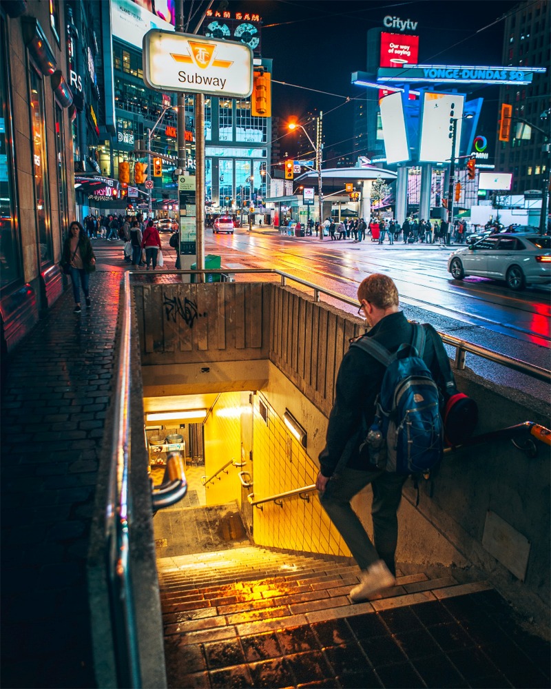 A photo of a subway entrance and lots of people at Yonge-Dundas Square, one of Toronto's most popular tourist destinations.