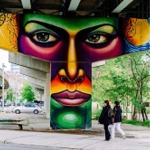 This is a photograph of street art/graffiti on an underpass pier at 507 King Street East in Toronto, Ontario, Canada.